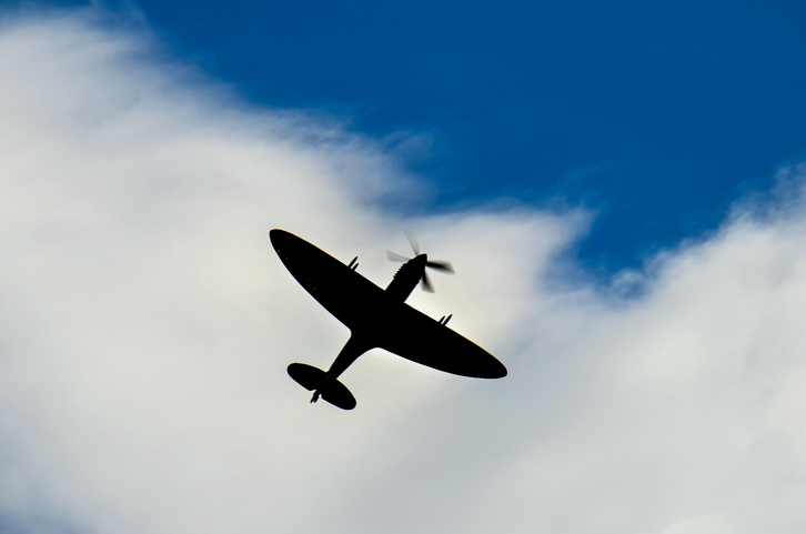 Spitfire fighter silhuette on sky
